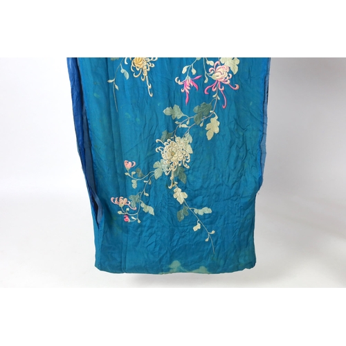 305 - An early 20th century silk crêpe Japanese kimono and fringed tie belt, the back panel heavily embroi... 