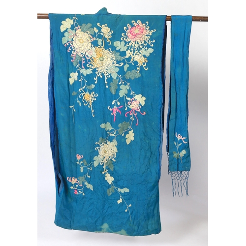 305 - An early 20th century silk crêpe Japanese kimono and fringed tie belt, the back panel heavily embroi... 