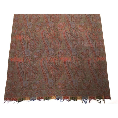 308 - An 1860s-70s Scottish Paisley wool shawl, woven with multi coloured wools in a large scrolling tea... 