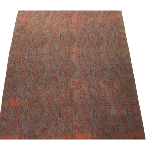 308 - An 1860s-70s Scottish Paisley wool shawl, woven with multi coloured wools in a large scrolling tea... 