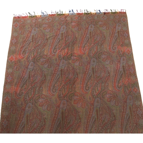 308 - An 1860s-70s Scottish Paisley wool shawl, woven with multi coloured wools in a large scrolling tea... 