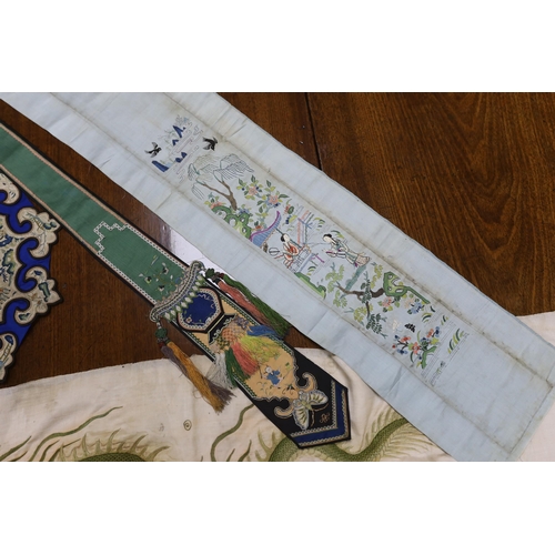 313 - A collection of Chinese embroideries, to include a pair of tasselled embroidered panels to a wedding... 