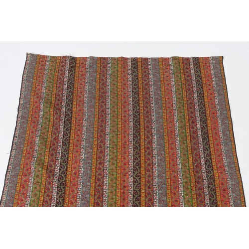 318 - A 19th century Kashmir, multi coloured, striped twill, woven wool shawl, with the fringe cut one end... 