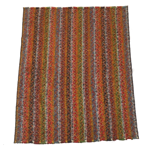 318 - A 19th century Kashmir, multi coloured, striped twill, woven wool shawl, with the fringe cut one end... 