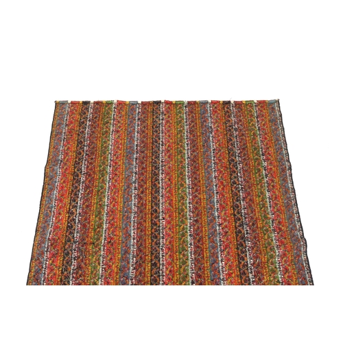 318 - A 19th century Kashmir, multi coloured, striped twill, woven wool shawl, with the fringe cut one end... 