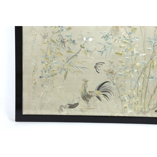 320 - A framed early 20th century Chinese silk embroidered shawl, embroidered with chickens, ducks, flying... 