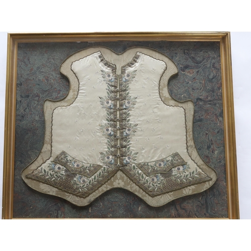 321 - A rare framed George III gentlemans ivory silk waistcoat front. Embroidered with a fine ivory spot ... 