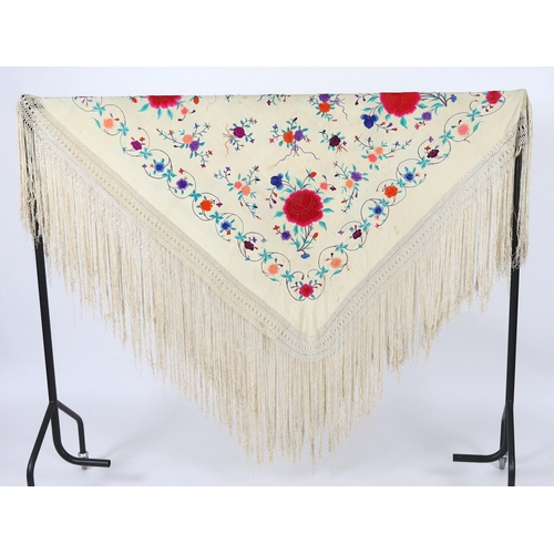 322 - A late 19th / early 20th century cream silk fringed shawl, embroidered with all over polychrome silk... 