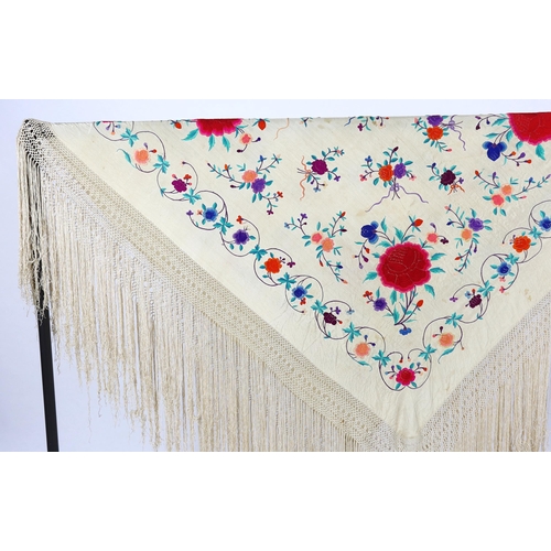 322 - A late 19th / early 20th century cream silk fringed shawl, embroidered with all over polychrome silk... 