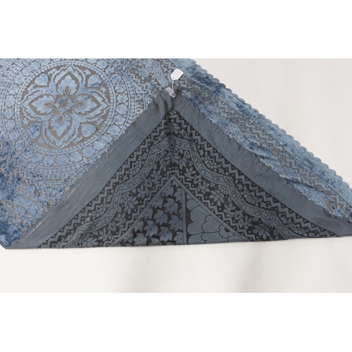 327 - A 20th century blue and black patterned silk cut velvet evening stole with scalloped borders, 102cm ... 