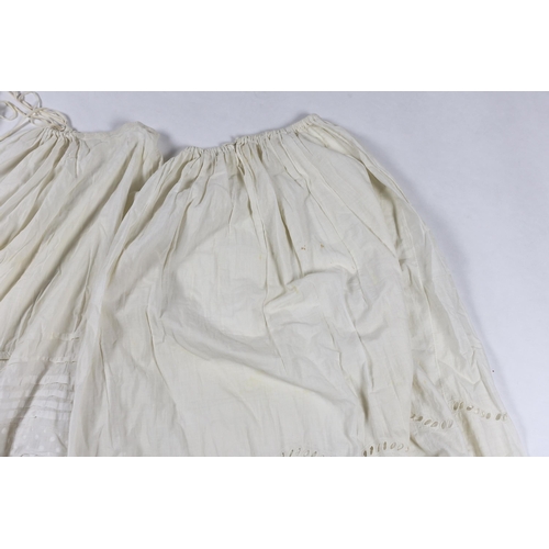 328 - Three Victorian white worked petticoats; one two tiered, one lace trimmed with ribboning, the third ... 