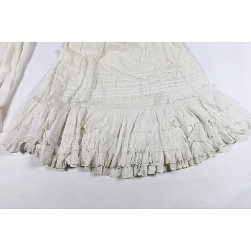 328 - Three Victorian white worked petticoats; one two tiered, one lace trimmed with ribboning, the third ... 