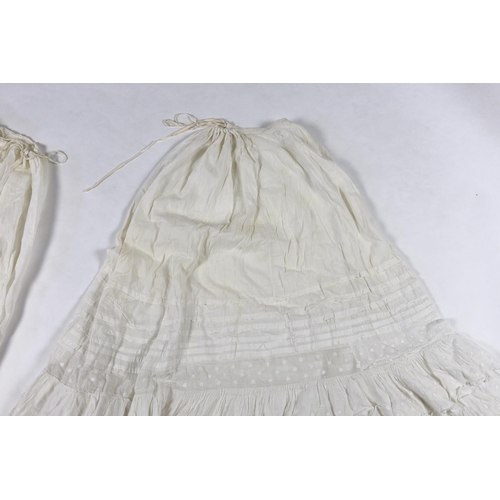 328 - Three Victorian white worked petticoats; one two tiered, one lace trimmed with ribboning, the third ... 