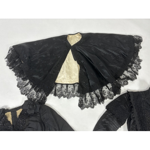 329 - Two ladies Victorian black satin and lace, bead trimmed bodices, together with a black lace cape, a ... 