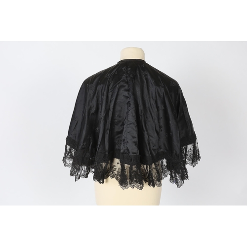 329 - Two ladies Victorian black satin and lace, bead trimmed bodices, together with a black lace cape, a ... 