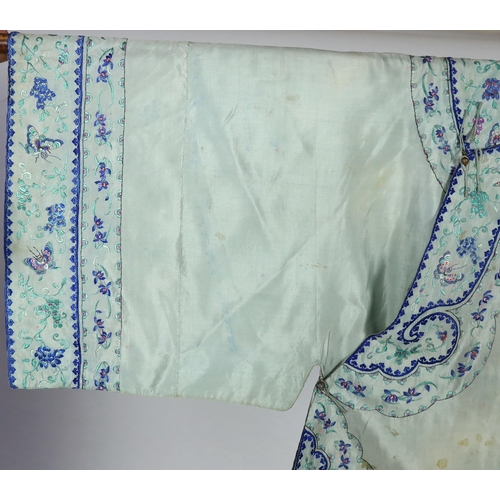 330 - A 1930's Chinese silk embroidered robe, in pale turquoise silk with wide pastel embroidery of butter... 