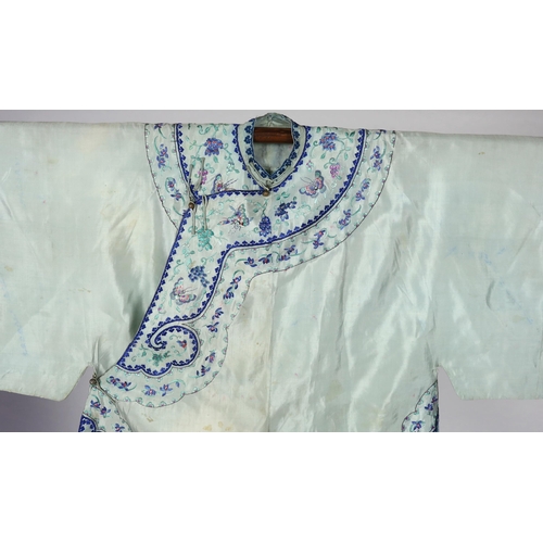 330 - A 1930's Chinese silk embroidered robe, in pale turquoise silk with wide pastel embroidery of butter... 