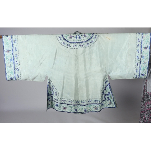 330 - A 1930's Chinese silk embroidered robe, in pale turquoise silk with wide pastel embroidery of butter... 