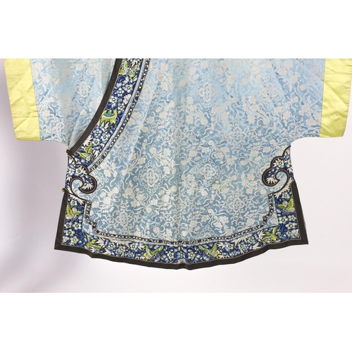 331 - A late 19th / early 20th century silk damask robe, edged with highly ornate embroidered silk braidin... 