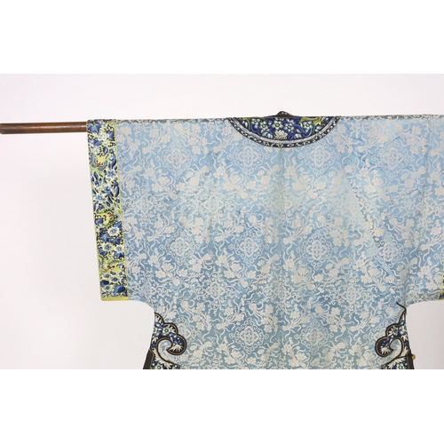 331 - A late 19th / early 20th century silk damask robe, edged with highly ornate embroidered silk braidin... 