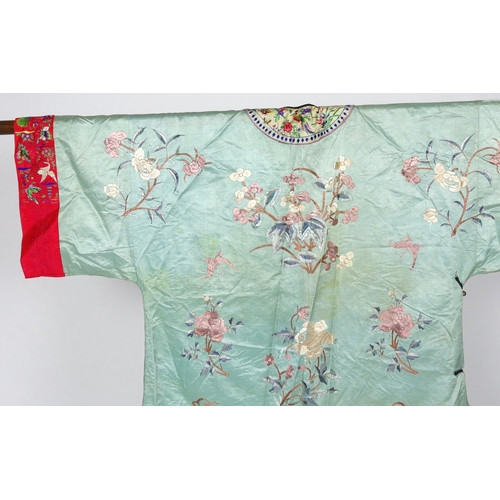 332 - An early 20th century Chinese silk embroidered turquoise robe, embroidered in pastel silk with butte... 