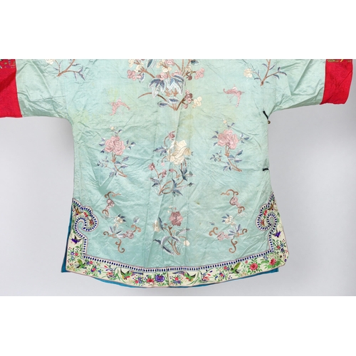 332 - An early 20th century Chinese silk embroidered turquoise robe, embroidered in pastel silk with butte... 