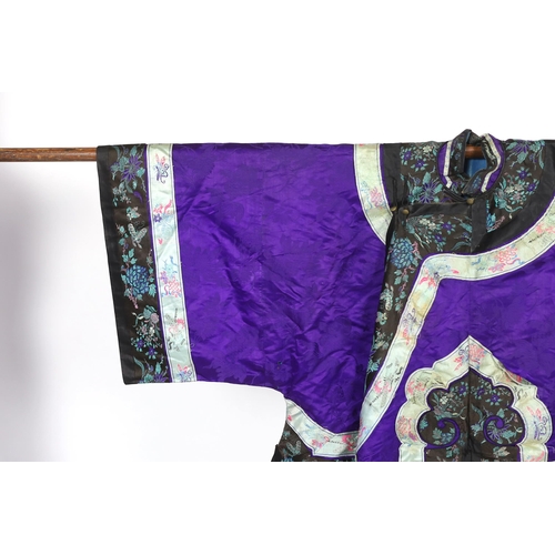 333 - A Chinese purple damask jacket, circa late 19th / early 20th century, decorated with black and turqu... 