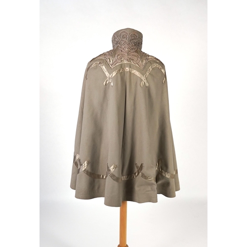 339 - An Edwardian mushroom wool evening cape, decorated with silk ribbon worked strapping and ornate appl... 