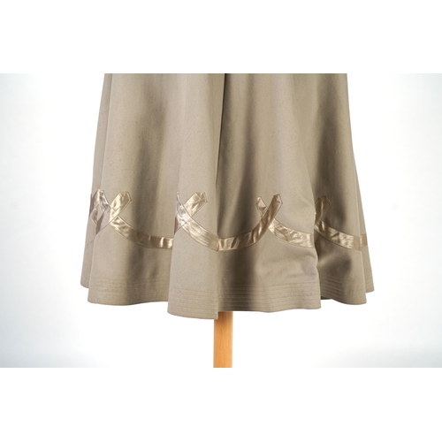 339 - An Edwardian mushroom wool evening cape, decorated with silk ribbon worked strapping and ornate appl... 