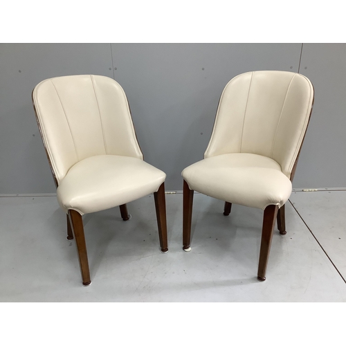 34 - A pair of Art Deco burr walnut and ivory leather chairs