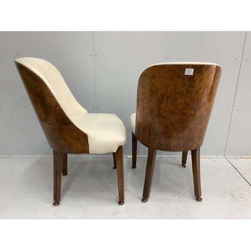 34 - A pair of Art Deco burr walnut and ivory leather chairs