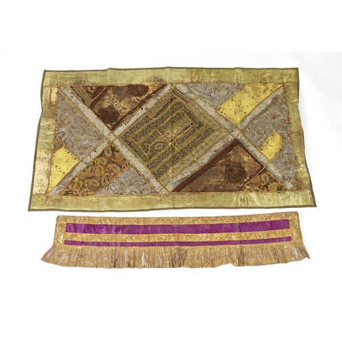 340 - A 20th century Indian patchwork hanging, designed in golds and browns using patchwork batik, beadwor... 