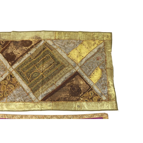 340 - A 20th century Indian patchwork hanging, designed in golds and browns using patchwork batik, beadwor... 