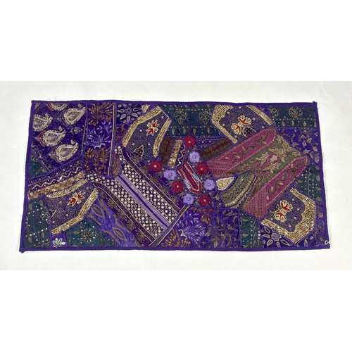 341 - An Indian embroidered bed cover and patchwork hanging, the bed cover with a large floral embroidered... 