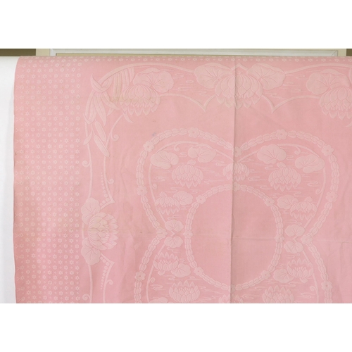 345 - An early 20th century pink lily pad and bull rush designed woven Marcella bedspread, 192cm wide, 2... 