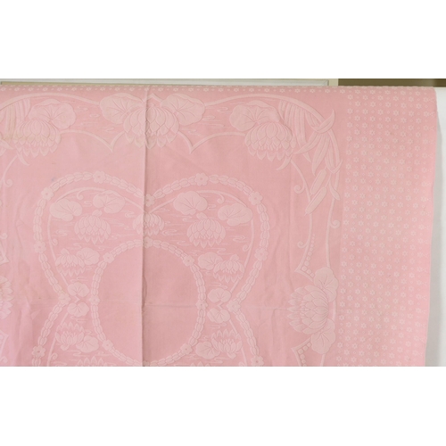 345 - An early 20th century pink lily pad and bull rush designed woven Marcella bedspread, 192cm wide, 2... 