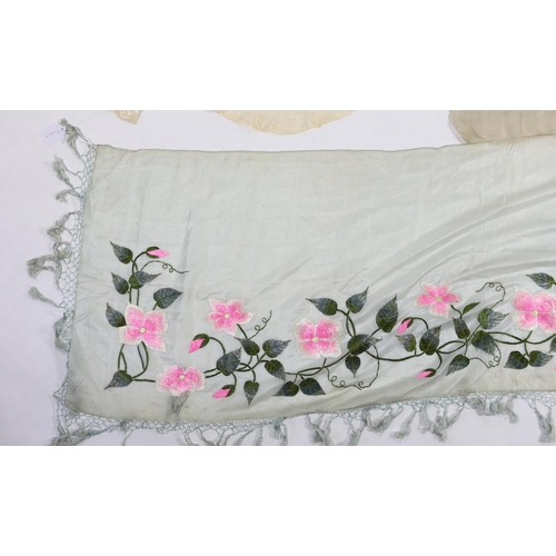 354 - An early 20th century fine spun silk embroidered and fringed pelmet, a lace and polychrome embroider... 