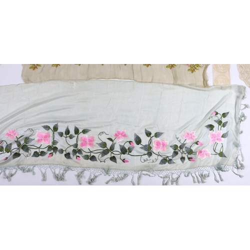 354 - An early 20th century fine spun silk embroidered and fringed pelmet, a lace and polychrome embroider... 