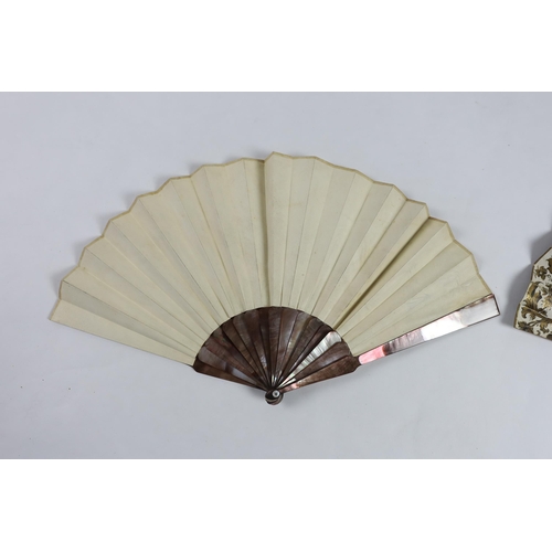 363 - A 19th century mother of pearl and carved bone fan with ornate printed paper leaf, together with a s... 