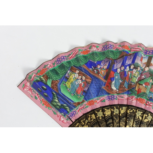 364 - A 19th century Chinese ornately lacquered and hand painted figural leaf fan, the figures on the leaf... 