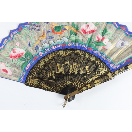 364 - A 19th century Chinese ornately lacquered and hand painted figural leaf fan, the figures on the leaf... 