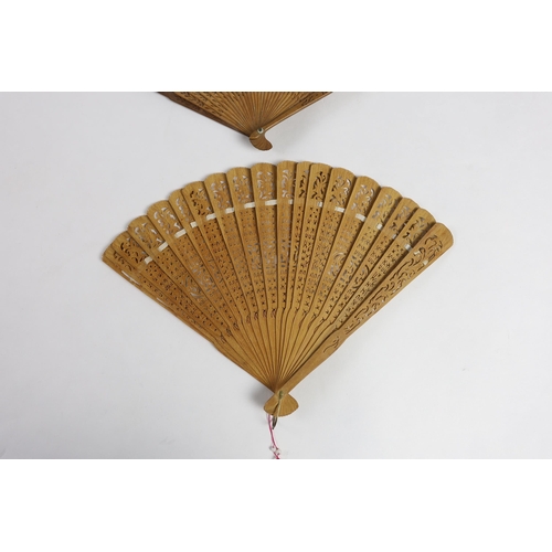 365 - A 19th century Chinese sandalwood brisé fan and a smaller 20th century Chinese sandalwood fan,... 