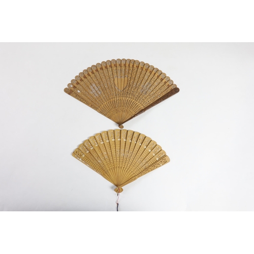 365 - A 19th century Chinese sandalwood brisé fan and a smaller 20th century Chinese sandalwood fan,... 