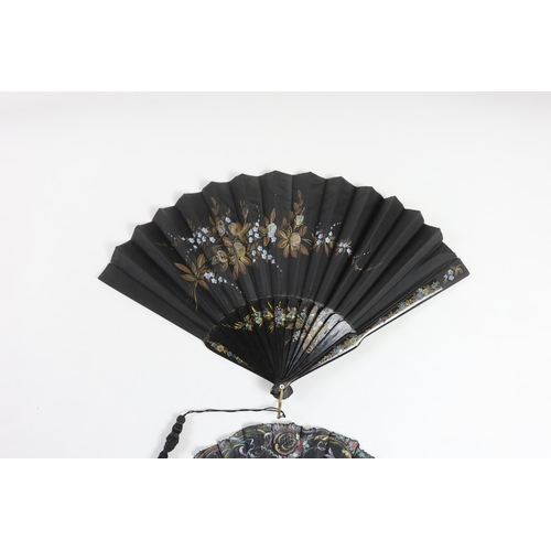 367 - A late 19th century hand painted shaped and carved figurative fan, signed, together with a lacquer a... 