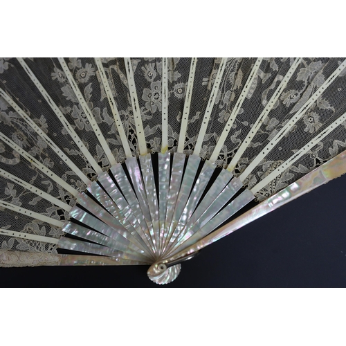 369 - An unusual commemorative Carrickmacross lace fan, possibly one made and entered for a group of compe... 