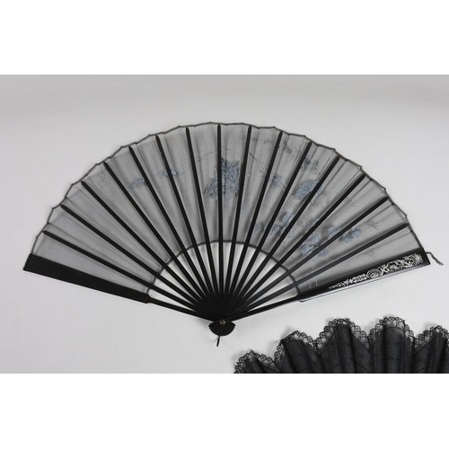 375 - An Edwardian black silk and ornate sequin fan, a similar fan with carved ebony guards and a fine gau... 