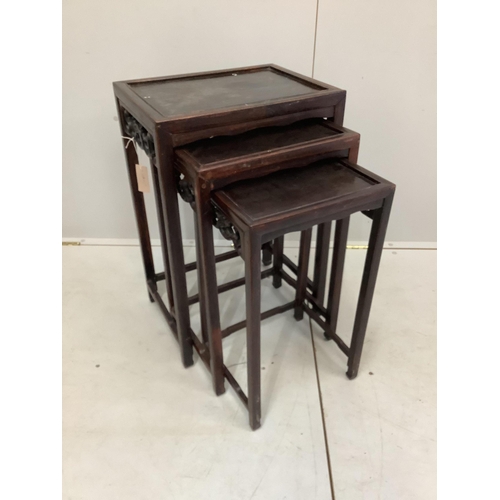 39 - A nest of three Chinese rectangular hardwood tables, width 44cm, depth 33cm, height 66cm