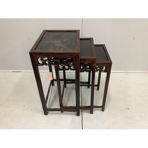 39 - A nest of three Chinese rectangular hardwood tables, width 44cm, depth 33cm, height 66cm