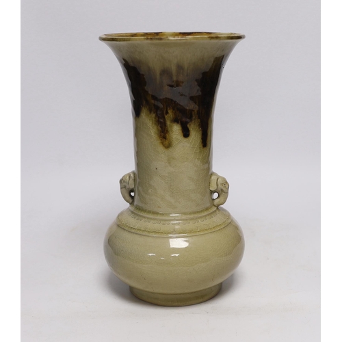 407 - A Japanese celadon and brown glazed vase with mythical beast handles, 27cm