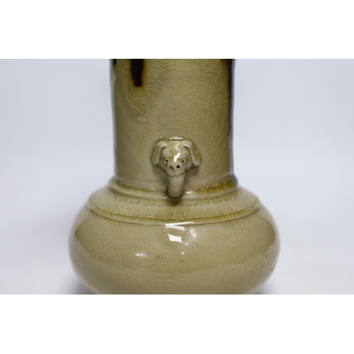 407 - A Japanese celadon and brown glazed vase with mythical beast handles, 27cm